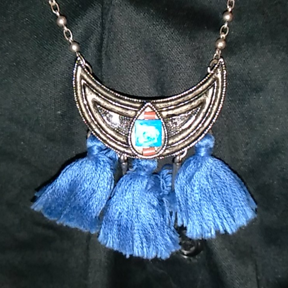 My grandma's tribal silver colored necklace. $14.